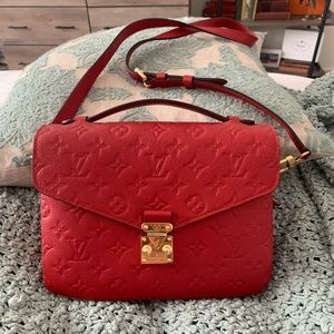 Red Louis Vuitton handbag